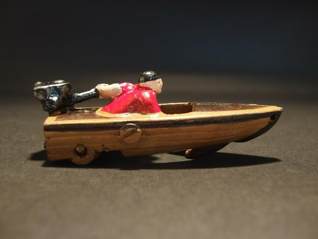 Mini Cast Iron Boat Racer Pull Toy: 4" Long 1 1/2" Tall 1 1/8" Wide Great little reproduction cast iron pull toy. All cast iron hand painted, slightly distress as shown in the images. Certainly looks old! Limited availability! Reserve: 