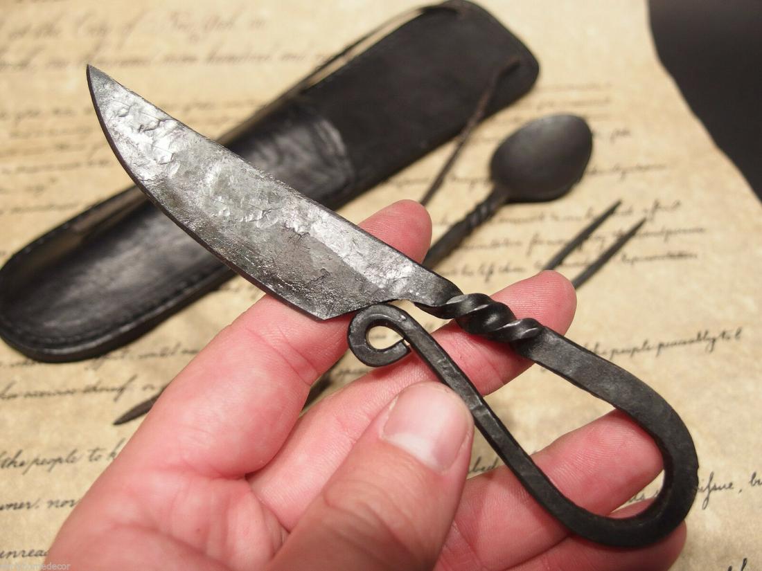 Flint Striker Style Custom Forged Primitive Knife: 10 1/4" Long x 2 5/8" Wide Knife 6" L 1 7/8" Wide Fork 6 3/4" Long Spoon 7 1/2" Nice hand made flint striker style knife. As you can see the talented craftsman curled the handle into the shape of an a