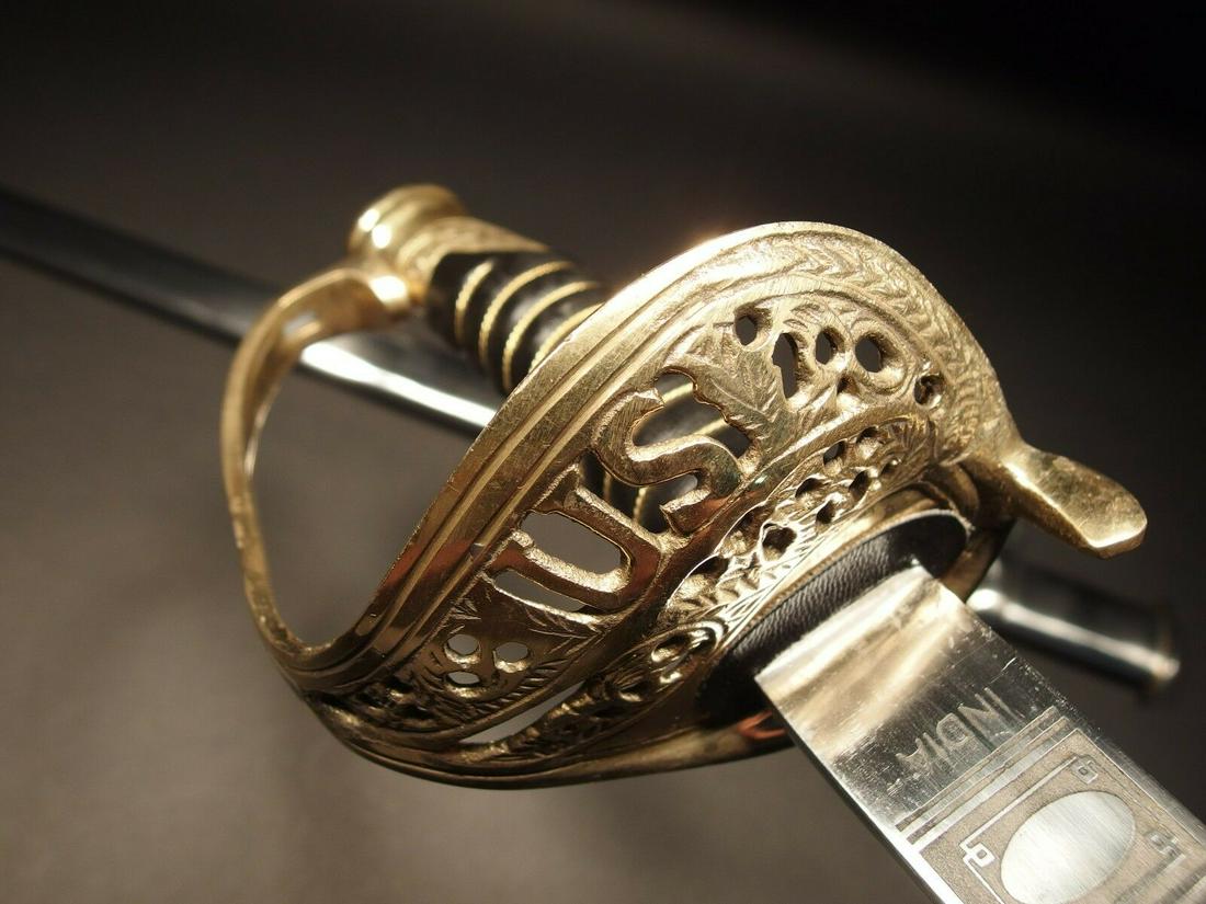 Light Cavalry Union Civil War Carbon Steel Sword: 38" Long with handle...with scabbard 42" 4" leather Grip Nice reproduction of a 1860 saber solid brass & leather wrapped handle, non sharpened carbon steel blade with a steel and brass scabbard. It ha
