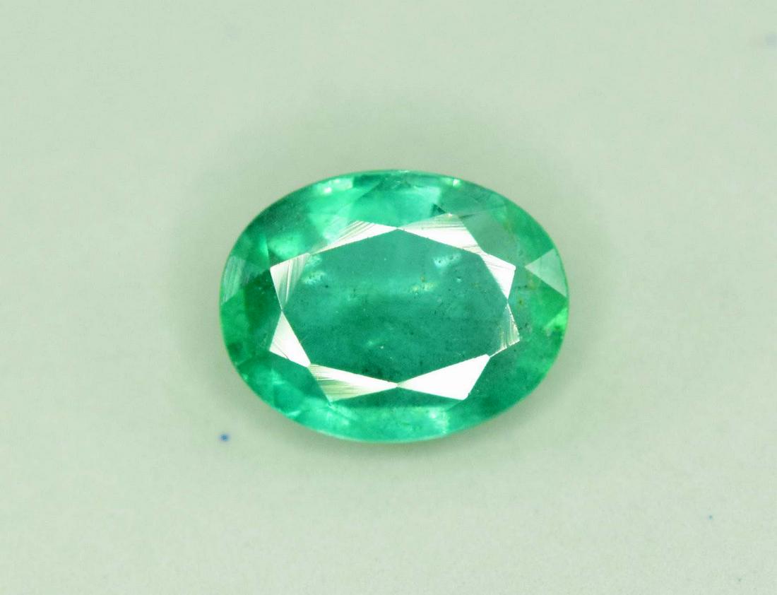0.85 Carats Lustrous Eye Clean Oval Cut Top Green Color (1 of 4)