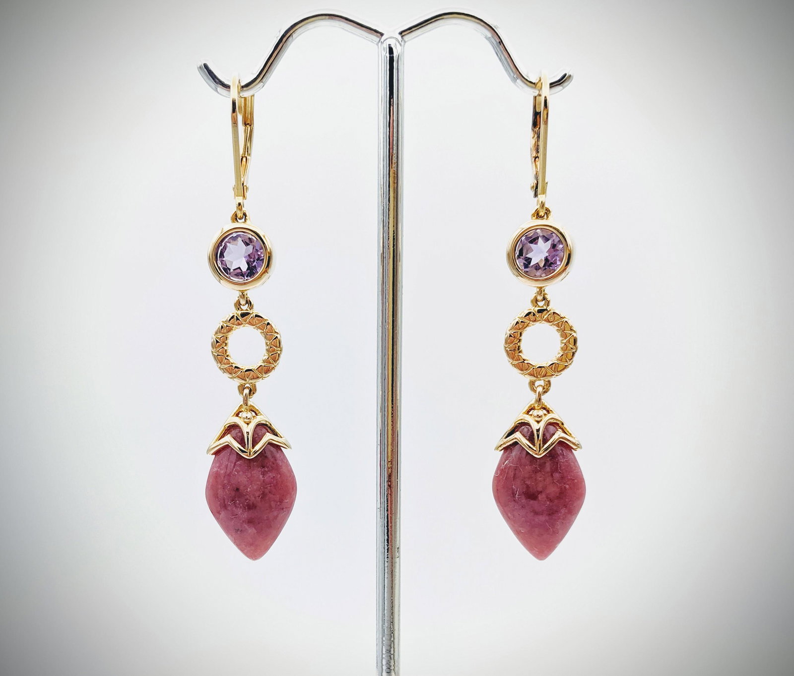 Rhodonite & Amethyst Earrings: Title: Rhodonite & Amethyst Earrings Brand: Jean Lin Collection Metal Purity: Gold Plated 925 Sterling Silver Gemstones: Rhodonite & Amethyst Carat Weights: Each Earring has 1 Round Amethyst at 5.5mm 