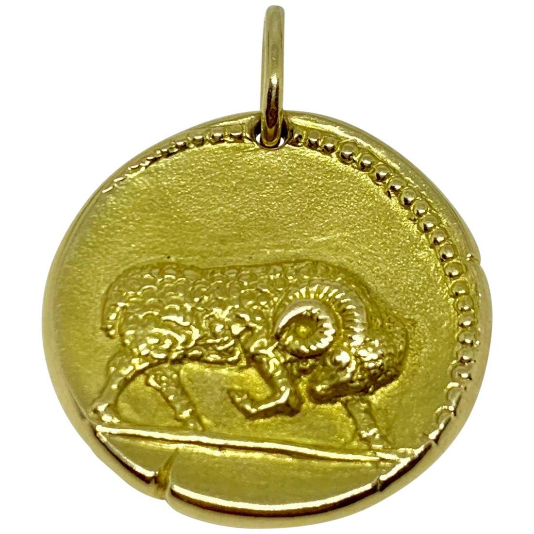 Georges Lenfant 18K Yellow Gold Aries Zodiac Sign: A wonderful Georges Lenfant 18k yellow gold zodiac pendant of the Aries sign who was a leading designer for Van Cleef & Arpels. It is styled as an antique coin. The reverse side features the date of A