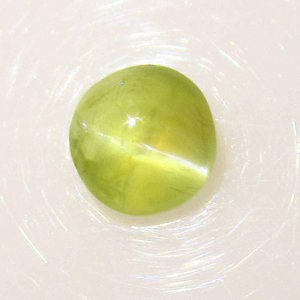 0.81 Ctw Natural Chrysoberyl Catseye 5.5 mm Round Cab: No Reserve! Title: 0.81 Ctw Natural Chrysoberyl Catseye 5.5 mm Round Cab Stone Clarity: Transparent Loose Gemstone: Chrysoberyl Catseye Carat Weights: 0.81 Size/Dimensions: 5.40 x 5.40 x 2.70 mm Good