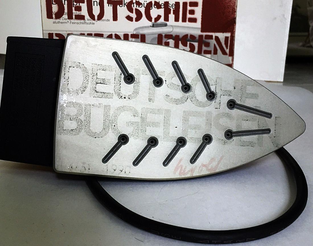 Georg Herold: Deutche Buegeleisen 1990: Artist: Georg Herold Title: Deutche Buegeleisen 1990 Medium: mixed media sculpture with paint Dimensions: 10 1/2" x 6 1/4" x 4 1/4" box, Iron is 10" x 4 1/4" x 5" Description: Stenciled Box and Iron,