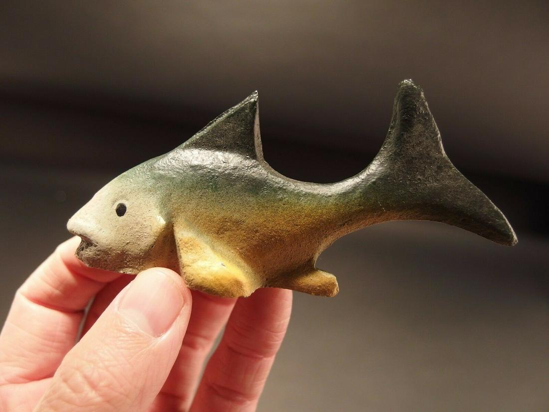 Cast Iron folk art Fish Beer Bottle Opener: 4 1/2" Long x 2 1/4" Tall Great reproduction cast iron bottle opener. This piece was made to look just like an antique, but is new. All our items come with a 100% customer satisfaction guarantee. Rese