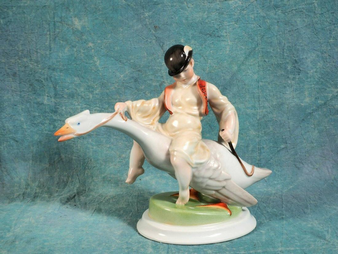 Herend Figurine Hungary Boy riding a goose Hand Painted: This is a beautiful Vintage figurine made by Herend in Hungary. The figurine features a small boy riding a goose. It shows the high quality of Herend porcelain It is marked with Herend back stamp and 