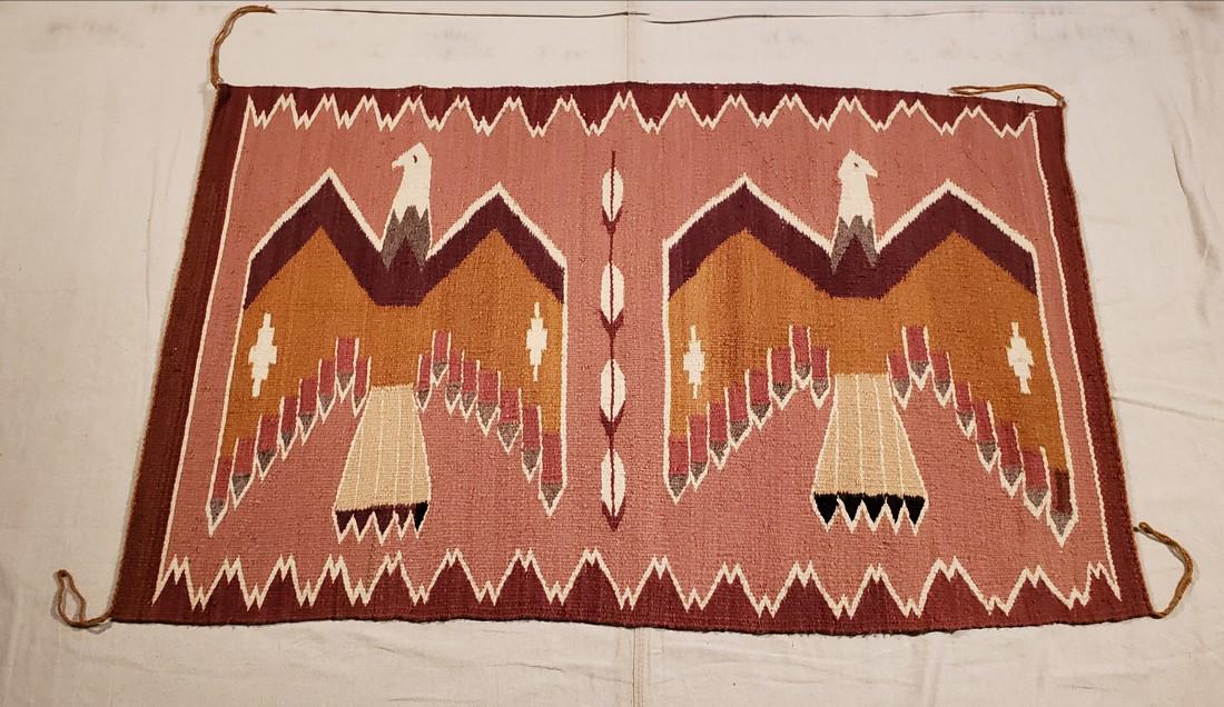 Navajo Double Thunderbirds Pictorial Rug Ca 1950's: Title: Navajo Double Thunderbirds Pictorial Rug Ca 1950's Dimension: 44 1/2" long x 28" wide Provenance:A great wall hanging with a classic Thunderbird design. Excellent condition. Exhibits lazy line 