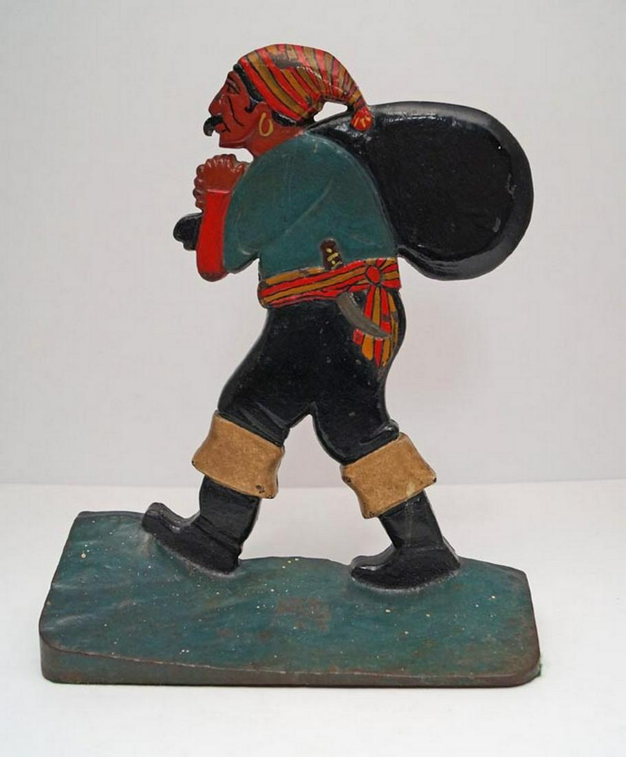 Antique Pirate w/ Pack Cast Iron Doorstop: Title: Antique Pirate w/ Pack Cast Iron Doorstop Date/Period: Circa 1920's Dimension: 12" tall x 9 3/4" wide Provenance:This doorstop has exceptional size, form, color, surface & patina. Shipping: Dom