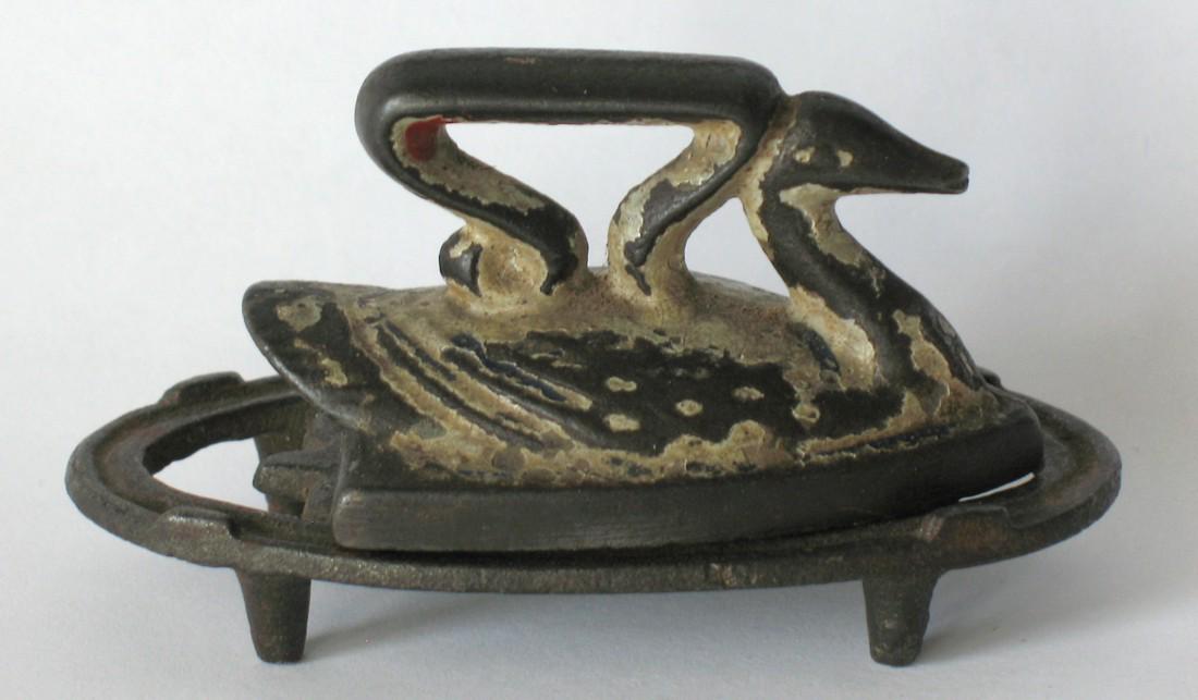 Early Miniature Swan Iron & Trivet.: Title: Early Miniature Swan Iron & Trivet. Date/Period: Early 1900's Dimension: 3” long. Provenance:Very nice early cast iron miniature swan sad iron and trivet with great patina. Shipping: Domestic