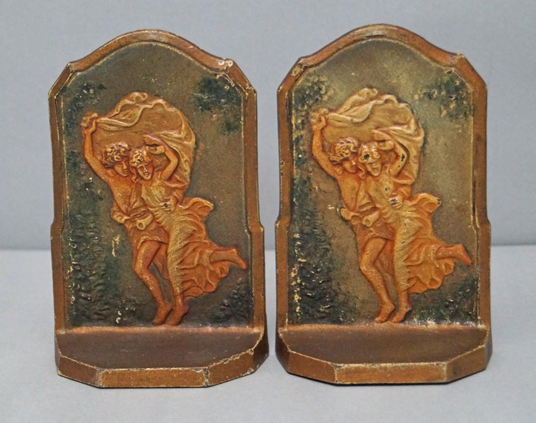 Semi Nude Couple The Storm Cast Iron Bookends 1928: Title: Semi Nude Couple The Storm Cast Iron Bookends 1928 Date/Period: Circa 1920’s-30’s Dimension: 5 7/8" tall x 3 7/8" wide x 1 5/8" deep Provenance:A pair of Antique Cast Iron Bookends. Shows a