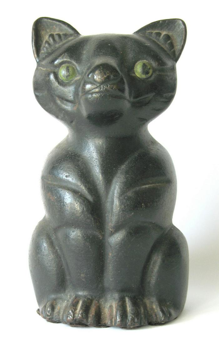 Early Cast Iron Black Cat Doorstop.: Title: Early Cast Iron Black Cat Doorstop. Date/Period: 1930's Dimension: 7” tall Provenance:Very nice early cast iron black cat with green eyes doorstop. Shipping: Domestic: Flat-rate of $25.00 to 