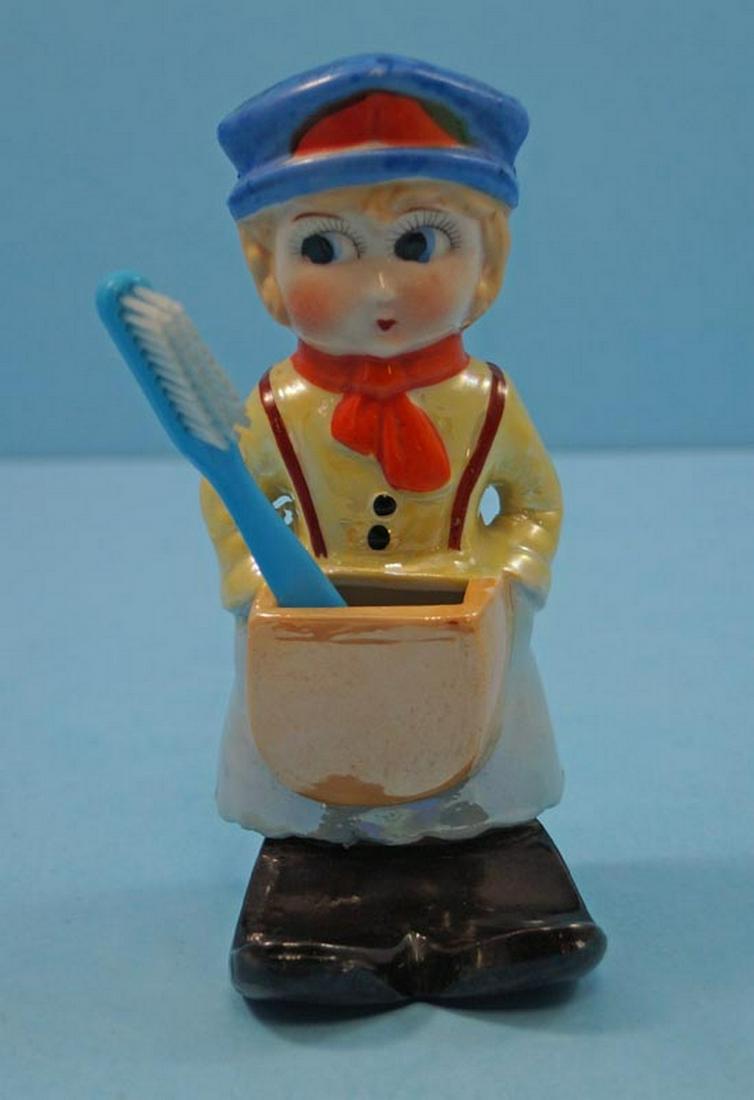 Railroad Ticket Collector Porcelain Toothbrush Holder: Title: Railroad Ticket Collector Porcelain Toothbrush Holder Date/Period: Circa 1940’s Dimension: 5 5/8" tall x 2 1/4" wide x 2 3/8" deep Provenance:A Vintage free standing or hanging porcelain Rail