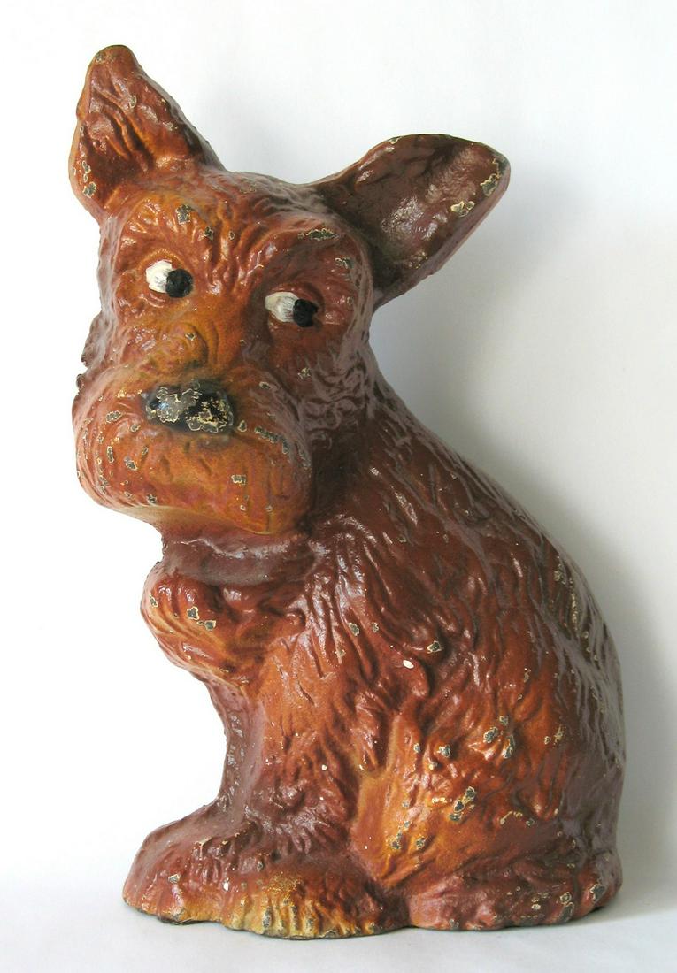Vintage Cast Iron Dog Doorstop.: Title: Vintage Cast Iron Dog Doorstop. Date/Period: 1960's Dimension: 7 1/2” tall Provenance:Nice vintage cast iron dog doorstop in great original paint. Marked on the back “Wilton Products”. Yo