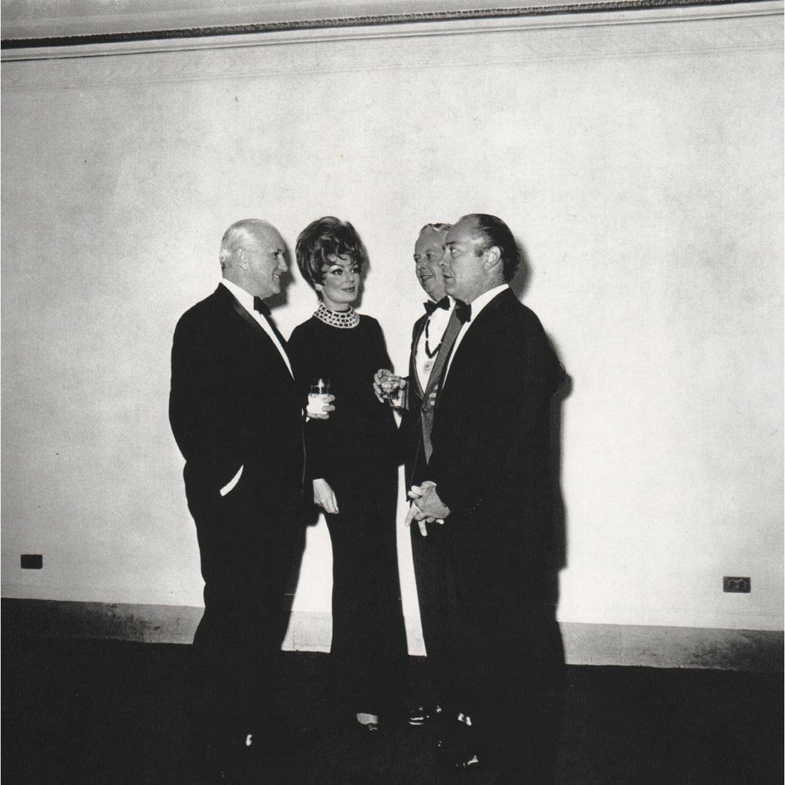 DIANE ARBUS - Four people at a Gallery Opening: Artist: DIANE ARBUS Print Title: Four people at a Gallery Opening, NYC, 1968 Medium: Sheet-fed Gravure Printing Date: 1970's Printed in Switzerland Image Size: 7 x 7 inches Diane Arbus was an American