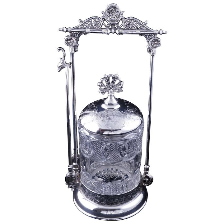 Eastlake Brooklyn silver plate pickle castor: Title: Eastlake Brooklyn silver plate pickle castor Size: 12x12x12 An ornate, shiny, solver-plate holder with a lovely and elaborate Victorian Eastlake design and a pressed patterned glass jar. A sunf