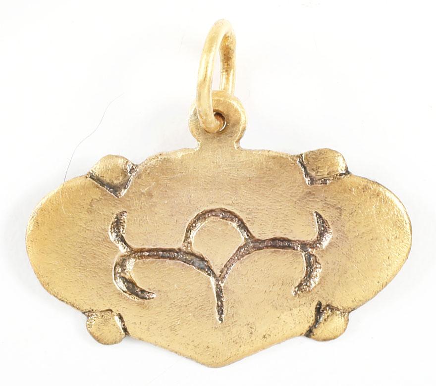 VIKING HEART PENDANT 9th-10th CENTURY AD: Slightly over 1” width. Made by the open mold process. Broad form heart with nubs at the quarter points and incised foliate decoration to the field. The heart stood for bravery, fortitude, loyal