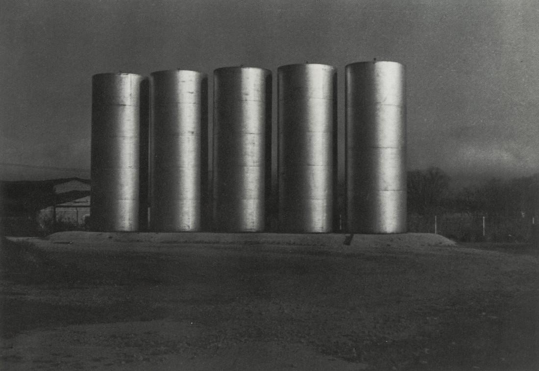 CHARLES SHEELER - Fuel Tanks, Wisconsin, 1952: Artist: Charles Sheeler Title: Fuel Tanks, Wisconsin, 1952 Medium: Photo Litho, 1989, USA Dimensions: 6.35x4.4" Heat Wax Mounted on 8.5x11" Conservation Board Charles Sheeler was a painter of American