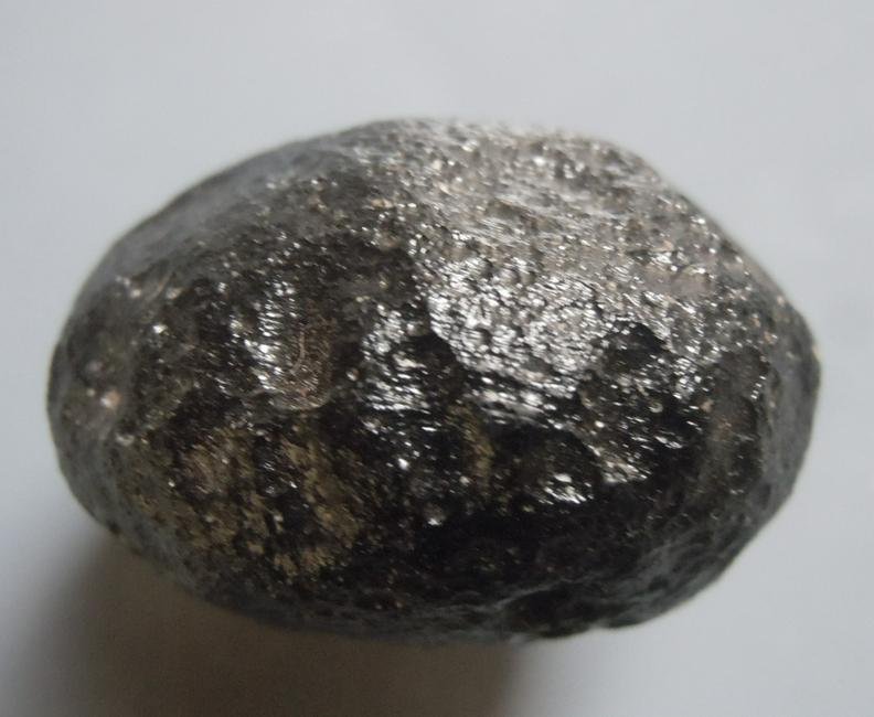 PHILIPPINITE TEKTITE - FROM METEORITE IMPACT: Title: PHILIPPINITE TEKTITE - FROM METEORITE IMPACT Origin: Paracale, Camarines Norte, Luzon, Philippines Size: 2.5x2x1.5 cm / 17 gram Description: round, lense shaped rizalite/philippinite tektite wi