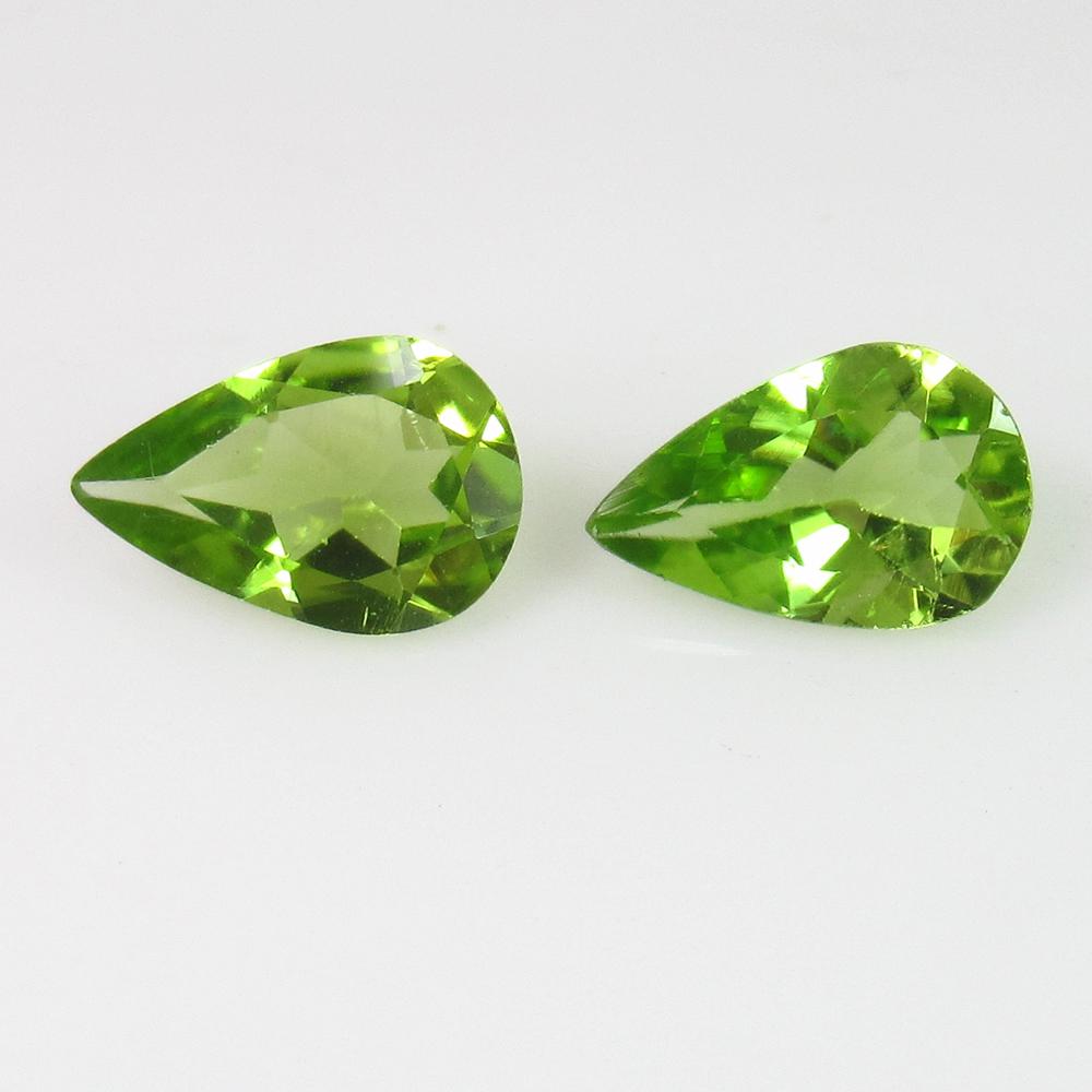 2.05 Ctw Natural Pakistan Peridot Pear Pair: No Reserve! Title: 2.05 Ctw Natural Pakistan Peridot Pear Pair Stone Clarity: VVS Gemstones: Peridot Carat Weights: 2.05 Size/Dimensions: 9.00 x 6.10 x 3.30 mm / 2 PC's Additional Information: Top Cla