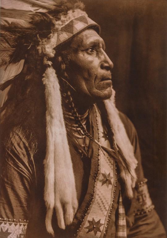 EDWARD CURTIS - Raven Blanket - Nez Perce, 1910: Artist: Edward Curtis Title: Raven Blanket - Nez Perce, 1910 Medium: Tri-Color Photo Litho, 2004, Italy Dimensions: 7x10" Heat Wax Mounted on 11x14" Conservation Board Edward Sheriff Curtis (1868 – 