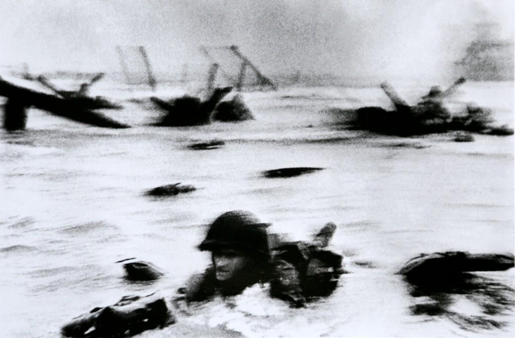 ROBERT CAPA - US forces' assault on Omaha Beach on: Artist: Robert Capa Title: US forces' assault on Omaha Beach on D-Day, June 6 1944 Date Printed: 2008 Medium: Photo Litho with Copyright Robert Capa / Magnum Photos Printer Location: Italy Additional