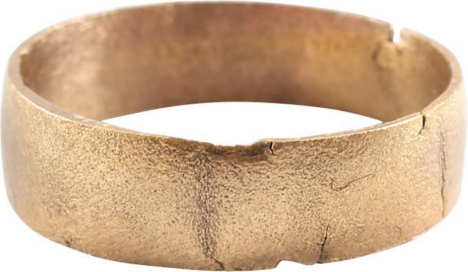 VIKING WOMAN’S WEDDING RING.: 10th-early 11th century AD. Gilt bronze, size 7. Broad 4.8 mm width band with low rounded face. The surface is lightly textured from burial. Vikings exchanged rings on the pommel of the groom’s swor