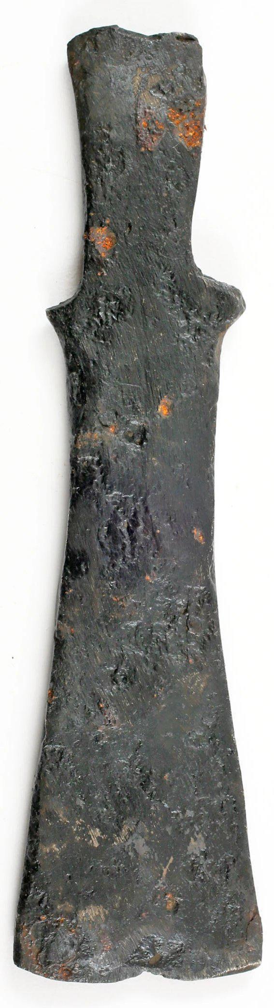 RARE SCYTHIAN BATTLE AXE, SAGARIS C.600-400 BC.: Iron, 5 " length, tapered with integral lugs to facilitate mounting in the haft by lashing. The sagaris is the first horseman's axe, used by the Scythians who are credited with mounted warfare. They a