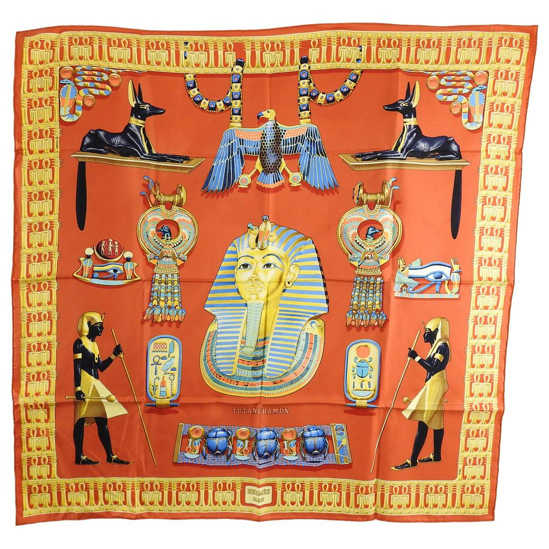 Hermes Tutankhamun Egyptian Pharaoh 90cm Silk Twill: Hermes Tutankhamun Egyptian Pharaoh 90cm Silk Twill Scarf. Ancient Egyptian design in orange, turquoise, yellow, and blue by Rybal. Excellent pre-owned condition with a small smudge at centre right as