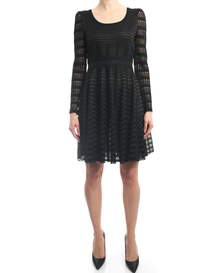 Alexander McQueen Black Mesh Long Sleeve Knit Dress - S: Alexander McQueen Black Mesh Long Sleeve Knit Dress. Original retail price tag of $3605 still attached. Rounded scoop neckline, fitted bodice, long sheer unlined sleeves, full skirt, invisible side zi