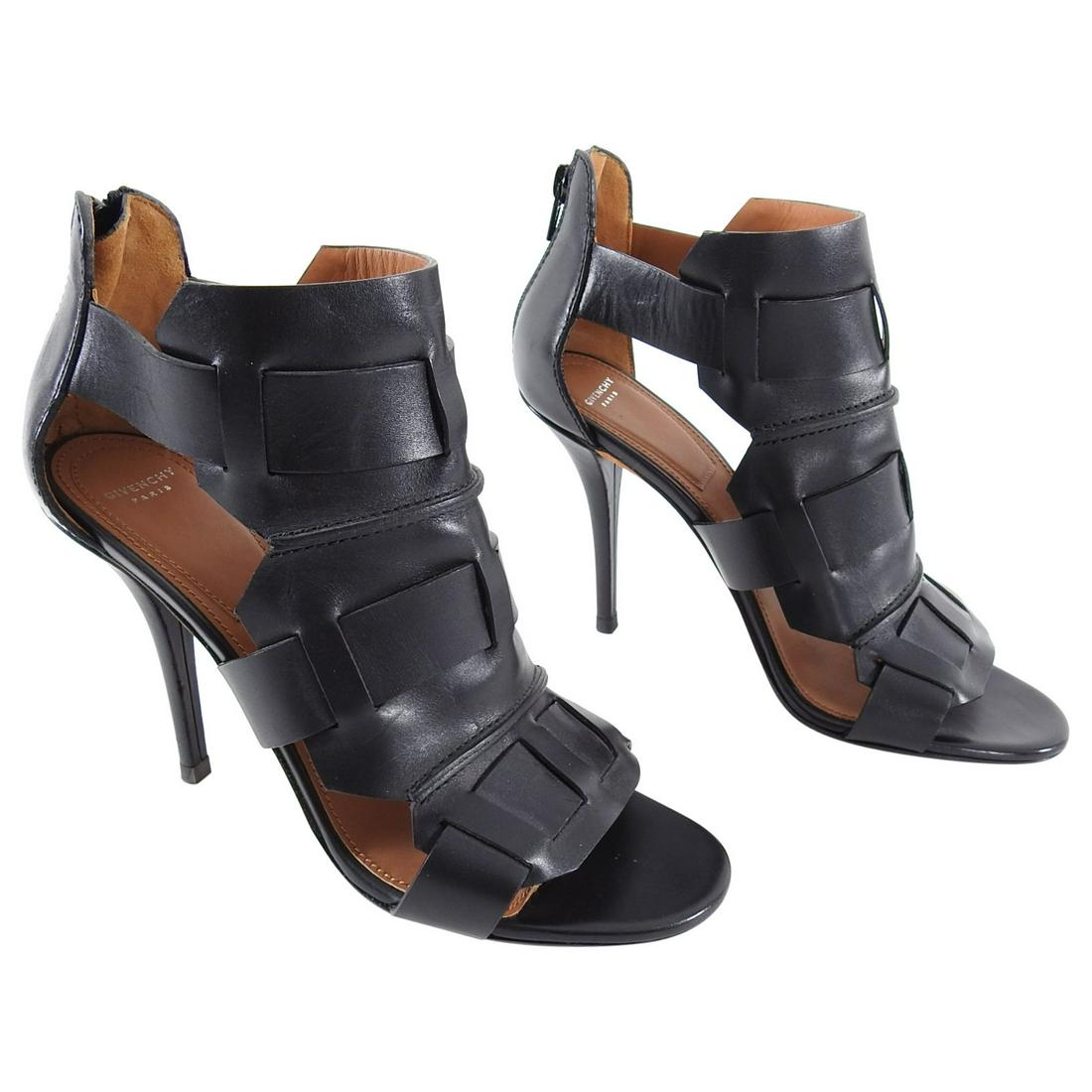 Givenchy Black Leather Gladiator High Heel Sandals - 40: Givenchy Black Leather Gladiator High Heel Sandals. 4.25" high heels, back heel zipper. Marked size 40 (USA 9.5). Brand new unworn with anti slip grips added to bottom soles. No duster or box. Reserve