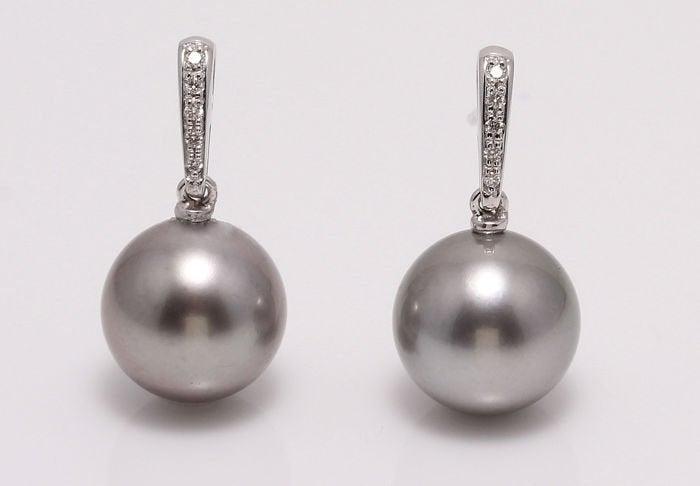 14 kt. White Gold - 11x12mm Tahitian Pearls - Earrings: Classic Elegance ! Emerging from the tropical lagoons of French Polynesia, these Tahitian pearls have been hand selected for their beautiful shine. They look lovely with the white gold and diamond ear