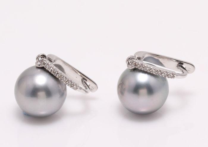 14 kt. White Gold - 11x12mm Round Tahitian Pearls -: Emerging from the tropical lagoons of French Polynesia, these pearls have a beautiful natural grey-green colour with a sharp lustre. The white gold and diamonds accentuate the cooler colours from the 