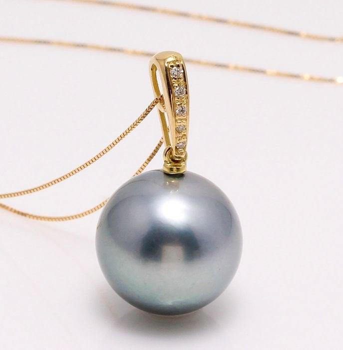 8 kt. Yellow Gold - 12x13mm Round Tahitian Pearl -: Emerging from the tropical lagoons of French Polynesia, this Tahitian pearl has a natural beautiful metallic grey body colour with shimmering overtones of green and purple. The yellow gold and diamond