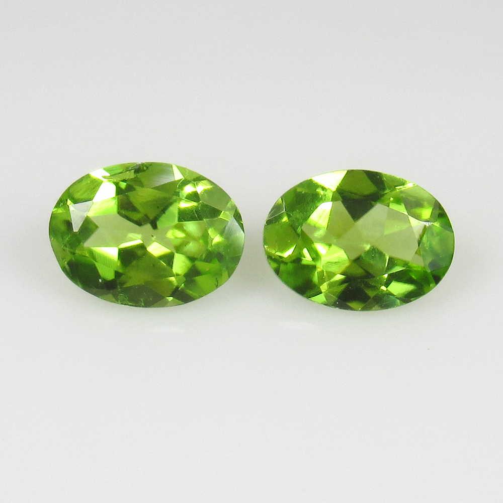 2.46 Ct Genuine Pakistan Peridot Oval Pair: No Reserve! Title: 2.46 Ct Genuine Pakistan Peridot Oval Pair Stone Clarity: VVS Gemstones: Natural Peridot Carat Weights: 2.46 Size/Dimensions: 8.00 x 6.00 x 3.70 mm / 2 PC's Additional Information: 