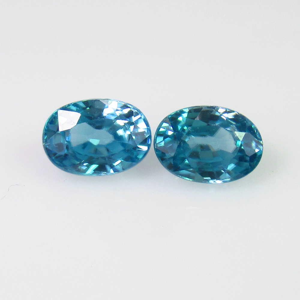 2.97 Ct Genuine Blue Zircon Nice Oval Pair: No Reserve! Title: 2.97 Ct Genuine Blue Zircon Nice Oval Pair Stone Clarity: VVS Gemstones: Natural Zircon Carat Weights: 2.97 Size/Dimensions: 7.00 x 5.20 x 3.80 mm / 2 PC's Additional Information: T