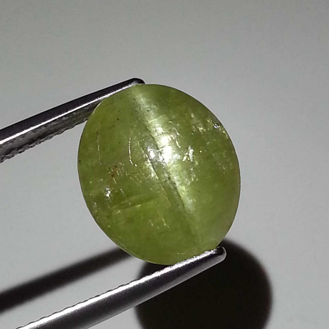 9.34 ct Natural Apatite cat's Eye: No Reserve! Title: 9.34 ct Natural Apatite cat's Eye Color/Clarity: Semi Transparent Gemstones: Loosegemstone Carat Weights: $9 Size/Dimensions: 12.80 x 11.10 x 7.40 Additional Information: Oval - Jha