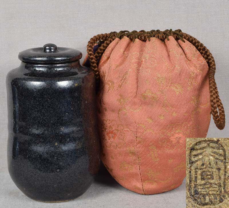 19c Japanese tea ceremony BLACK SETO CHAIRE tea caddy: Late Meiji (1890s-1910s) black Seto ware chaire (tea caddy for storing powdered green tea used in tea ceremony) with cover. Stoneware body of katatsuki shape, typical beautiful Japanese elliptical lin