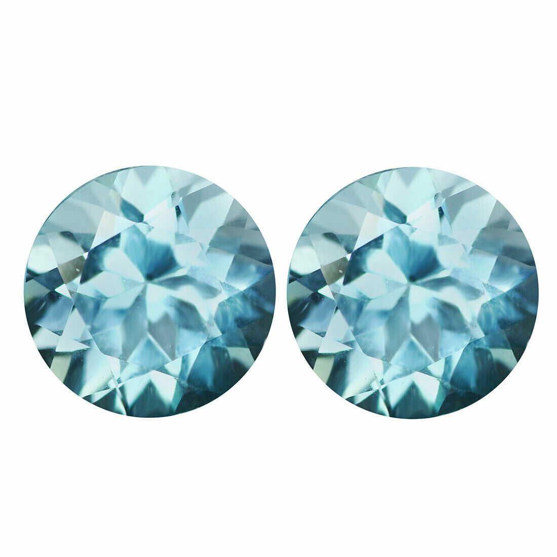 6.50 ct natural unheated aqua blue topaz pair: Title: 6.50 ct natural unheated aqua blue topaz pair Color/Clarity: aqua blue/VVS Gemstone Type: natural/untreated Carat Weights: 6.5 Size/Dimensions: 8.85 x 8.85 x 6.47 MM Origin: Brazil Reserve: $40