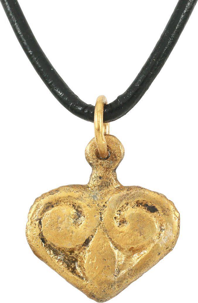 VIKING HEART PENDANT 900-1050 AD: Just over ¾” height, made by the open face mold method with broad borders terminating as a central trefoil motif and forming the cusped heart top. The foliate trefoil was a very popular motif for V