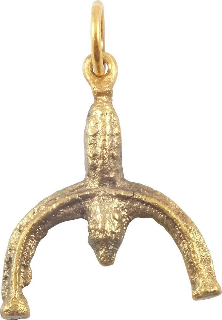 ANCIENT VIKING LUNAR PENDANT C.900-1000 AD: Gilt bronze. As expert navigators, the constellations signified mystery and power to Vikings. Lunar pendants were worn as pectorals as well as suspended from belts, other clothing and horse harnesses.