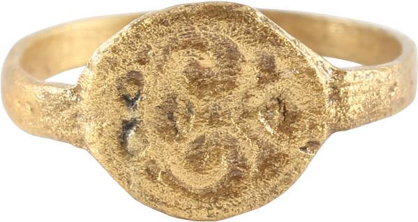 MEDIEVAL GIRLS RING C.1300-1500: Gilt bronze, size 4. Narrow, flat band slightly flared below the bezel. The shoulders with incised foliage. Slightly oval bezel incised with a symmetrical floral design surrounded by circles which may