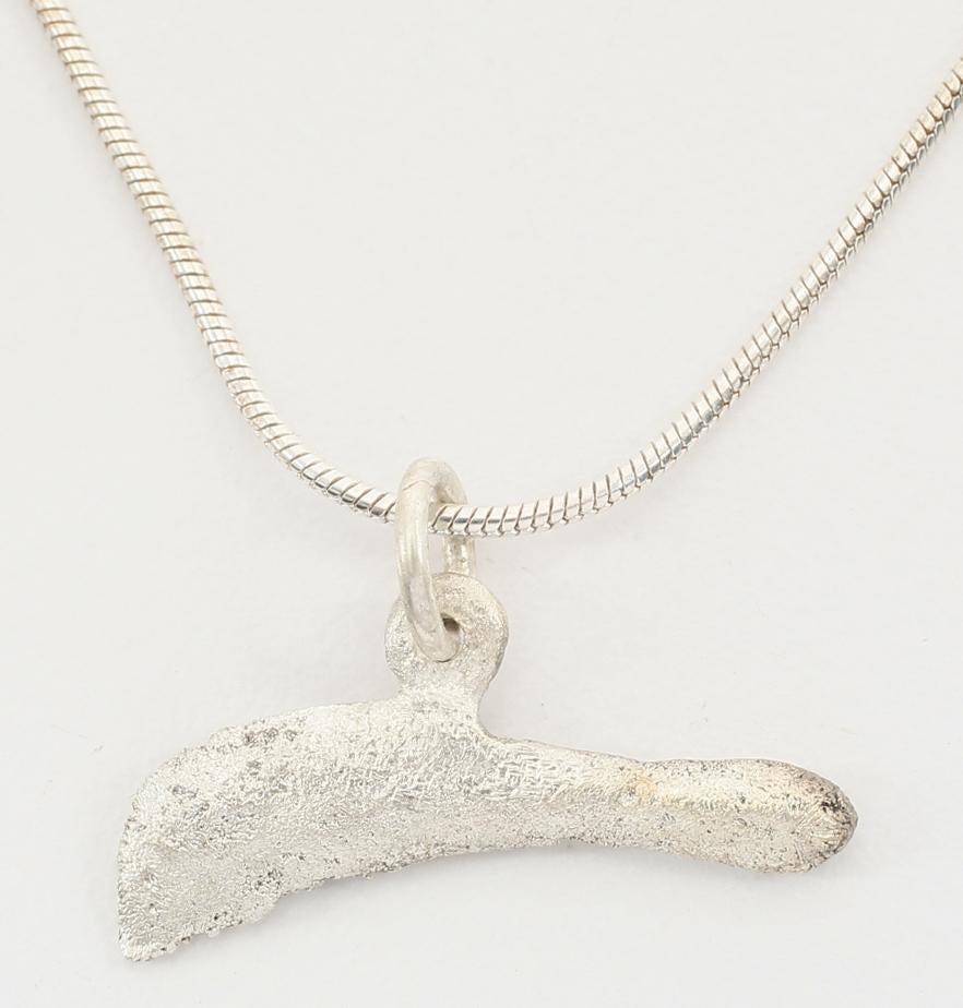 GREEK BRONZE DOLPHIN “COIN” PENDANT 5TH-4TH CENTURY BC: From the Greek Black Sea colony of Olbia which provided slaves, cereal and fish. Before die struck coinage, these dolphin figures served as a means of exchange, vital for commerce to thrive. They are