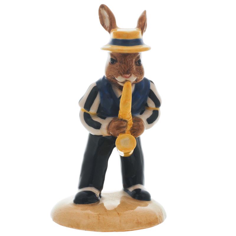 Saxophone Player Bunnykins: Description: Designed by Kimberley Curtis, Modelled by Shane Ridge. Issued in 1999 in a limited edition of 2500. Part of the Bunnykins Jazz Band. This piece is in mint condition with no chips, no crac