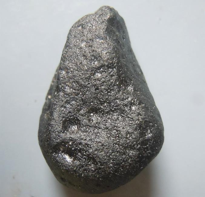 PHILIPPINITE TEKTITE - FROM METEORITE IMPACT: Title: PHILIPPINITE TEKTITE - FROM METEORITE IMPACT Origin: Paracale, Camarines Norte, Luzon, Philippines Size: 2x1.5x1 cm / 5 gram Description: cute teardrop shaped rizalite/philippinite tektite, one