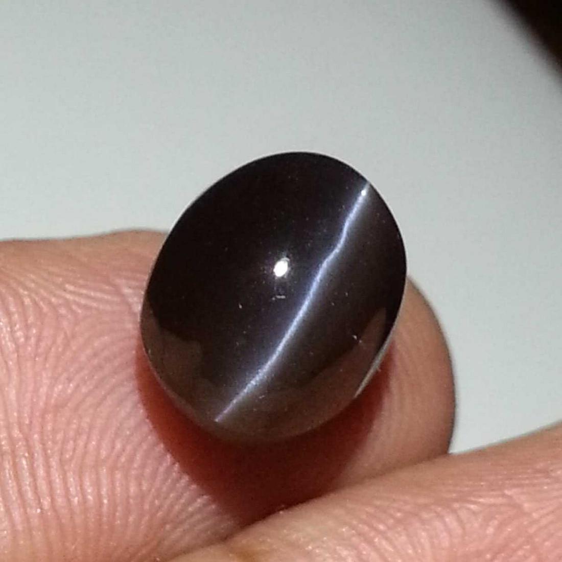 7.68 ct Natural Scapolite Cat' Eye: No Reserve! Title: 7.68 ct Natural Scapolite Cat' Eye Color/Clarity: Opaque Gemstones: Loosegemstone Carat Weights: 7.68 Size/Dimensions: 12.40 x 9.25 x 8.90 Oval - Africa Shipping: Worldwide: Flat-ra