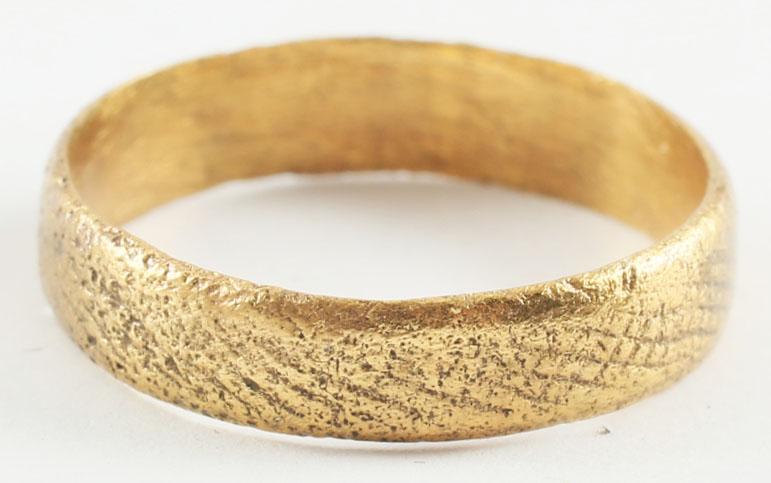 ANCIENT VIKING WOMAN’S WEDDING RING 866-1067 AD . SIZE: Gilt bronze. Danelaw England. Broad band with delicately rounded edges flanking a broad hatched field. Finely detailed with the gold surface restored. Vikings exchanged rings on the pommel of the groo