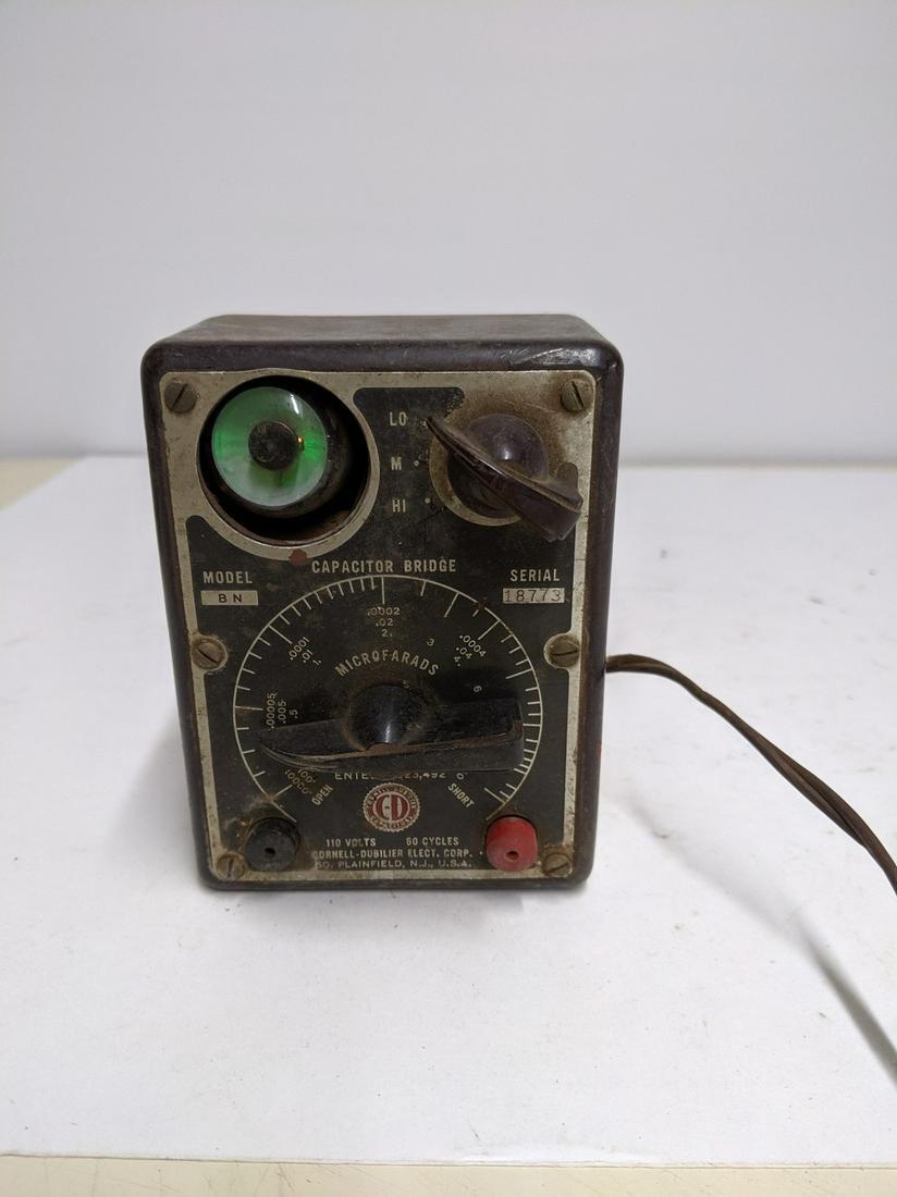Vintage Cornell Dubilier Model BN Tube Capacitor Bridge: Title: Vintage Cornell Dubilier Model BN Tube Capacitor Bridge Powers Lights Up Maker: CDE Description:Not tested beyond power, unless specified. From One of the largest collections on the East Coast 