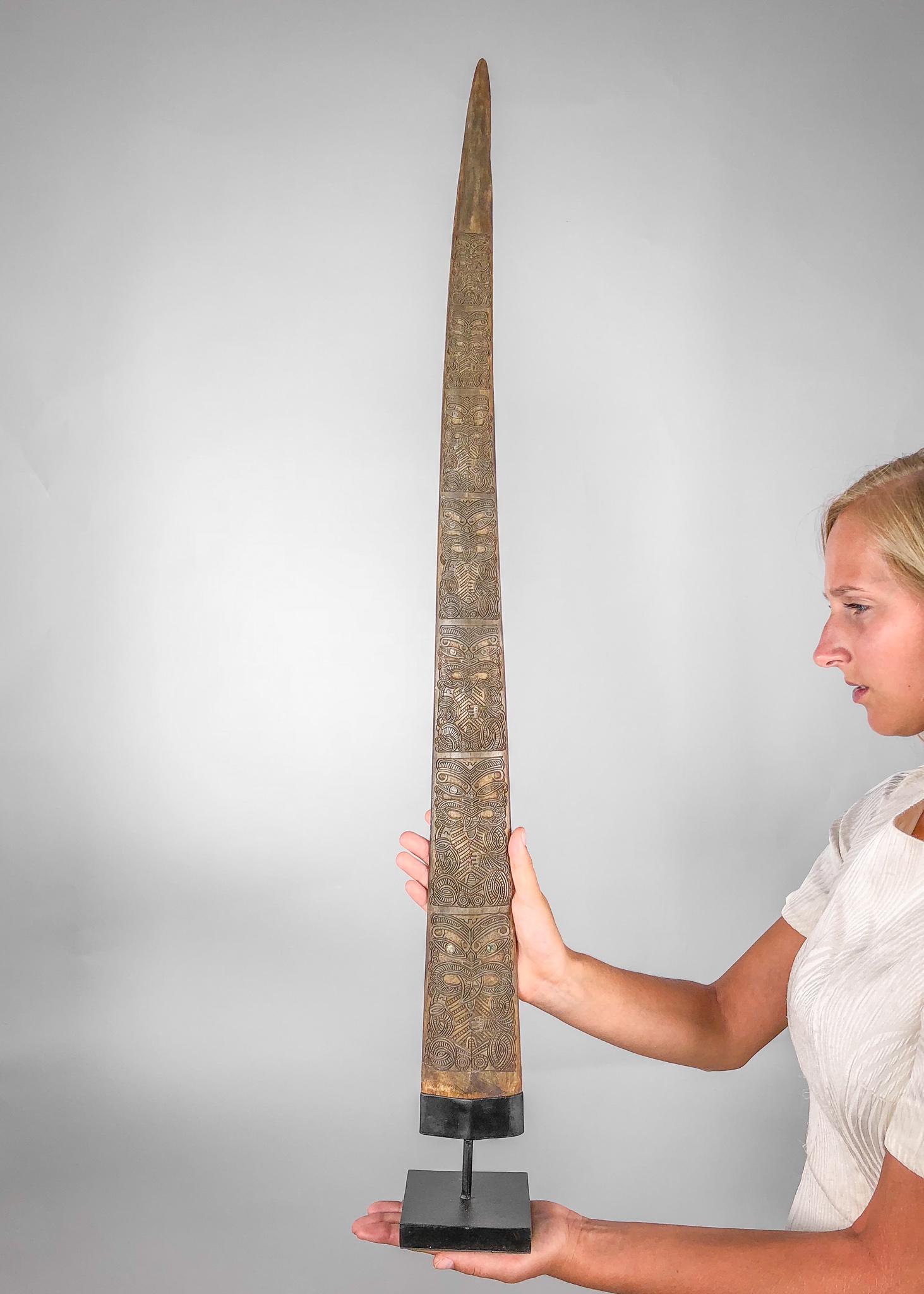 Fine Hand Carved Maori Swordfish Bill - Traditional: Title: Fine Hand Carved Maori Swordfish Bill - Traditional Wheku and Tiki Carving Maker: Unknown Origin: New Zealand Date/Period: 2017 Materials: Bone, Steel Dimensions: Height: 96.5cm / 38 inches Des