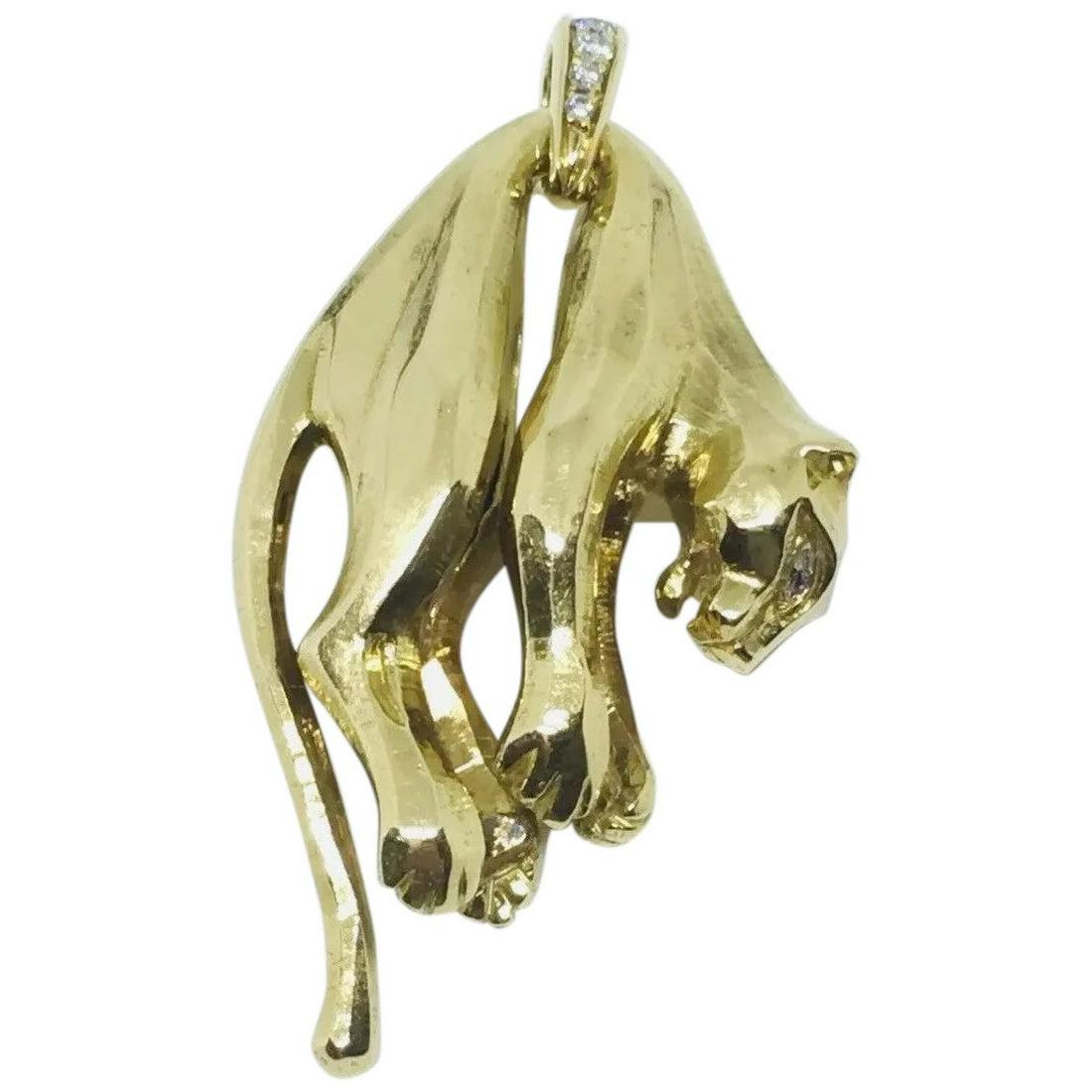 Cartier 18K Yellow Gold Diamond Panthere Pendant: This gorgeous panther pendant is an exemplary representative of the house of Cartier. It is in impeccable condition. It is a very rare highly collectible piece that has been discontinued. Artfully scu