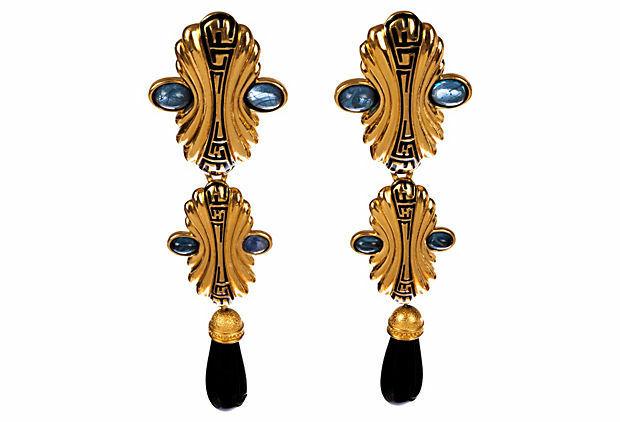 Fendi Chandelier Earrings: 18 kt gold plated earrings with faux blue sapphire lucite cabochons and faux black onyx drops.... Earrings are monogrammed with black enamel with the logo.... Circa, 1980's.... Earrings are 4” long